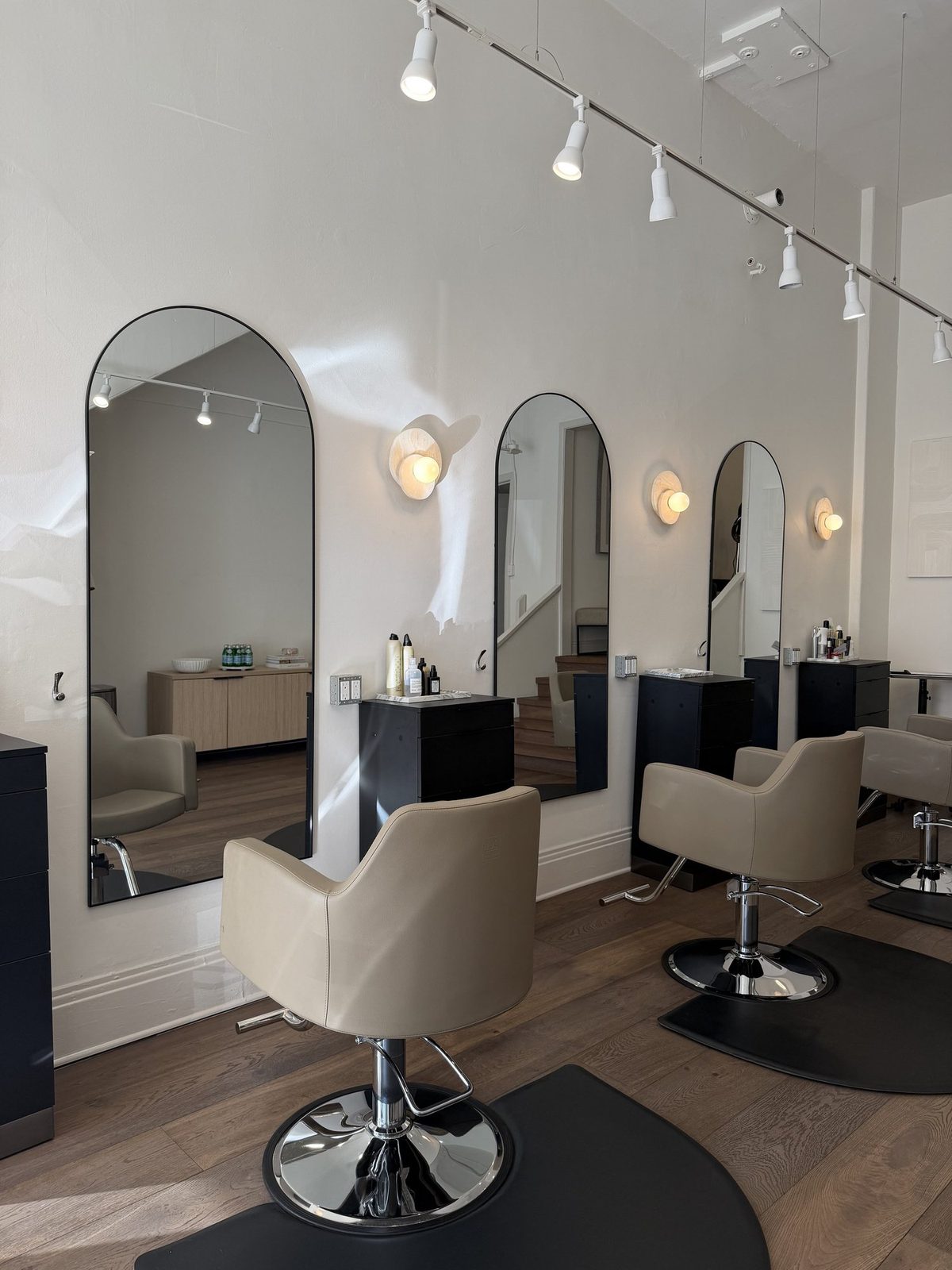 Arched mirrors and styling chairs at Era Salon