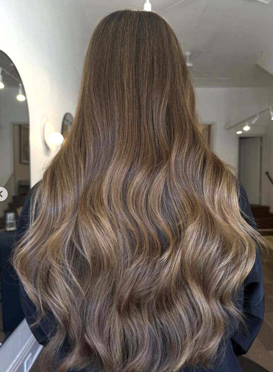 Long dimensional brunette waves created at Era Salon