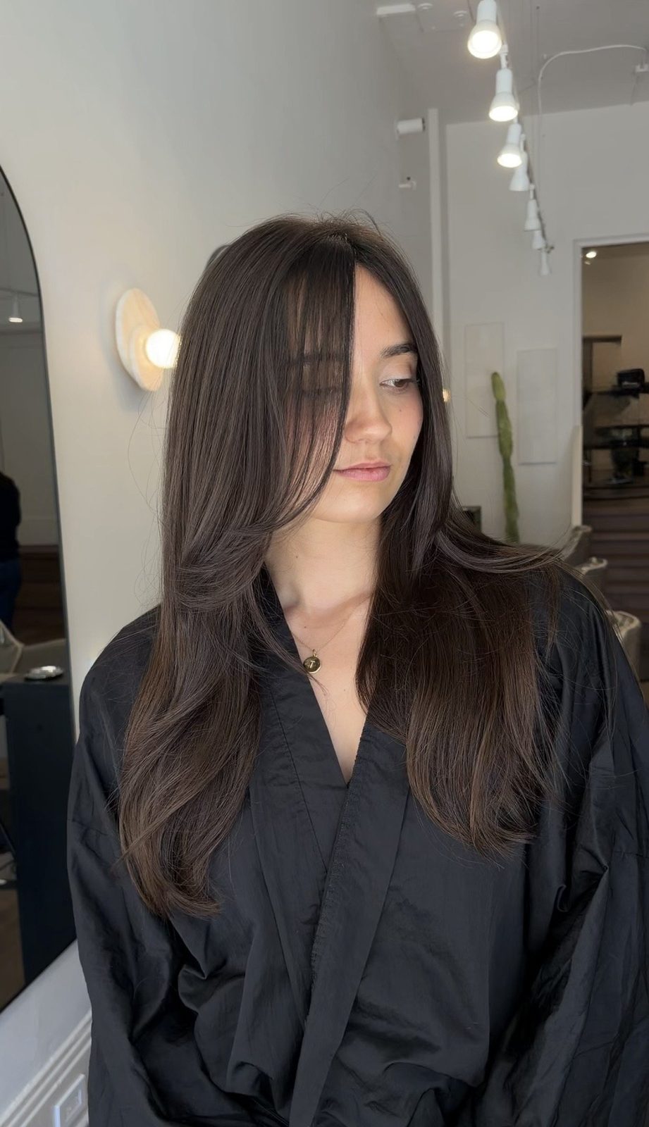 Long layered hair with sunlit dimension