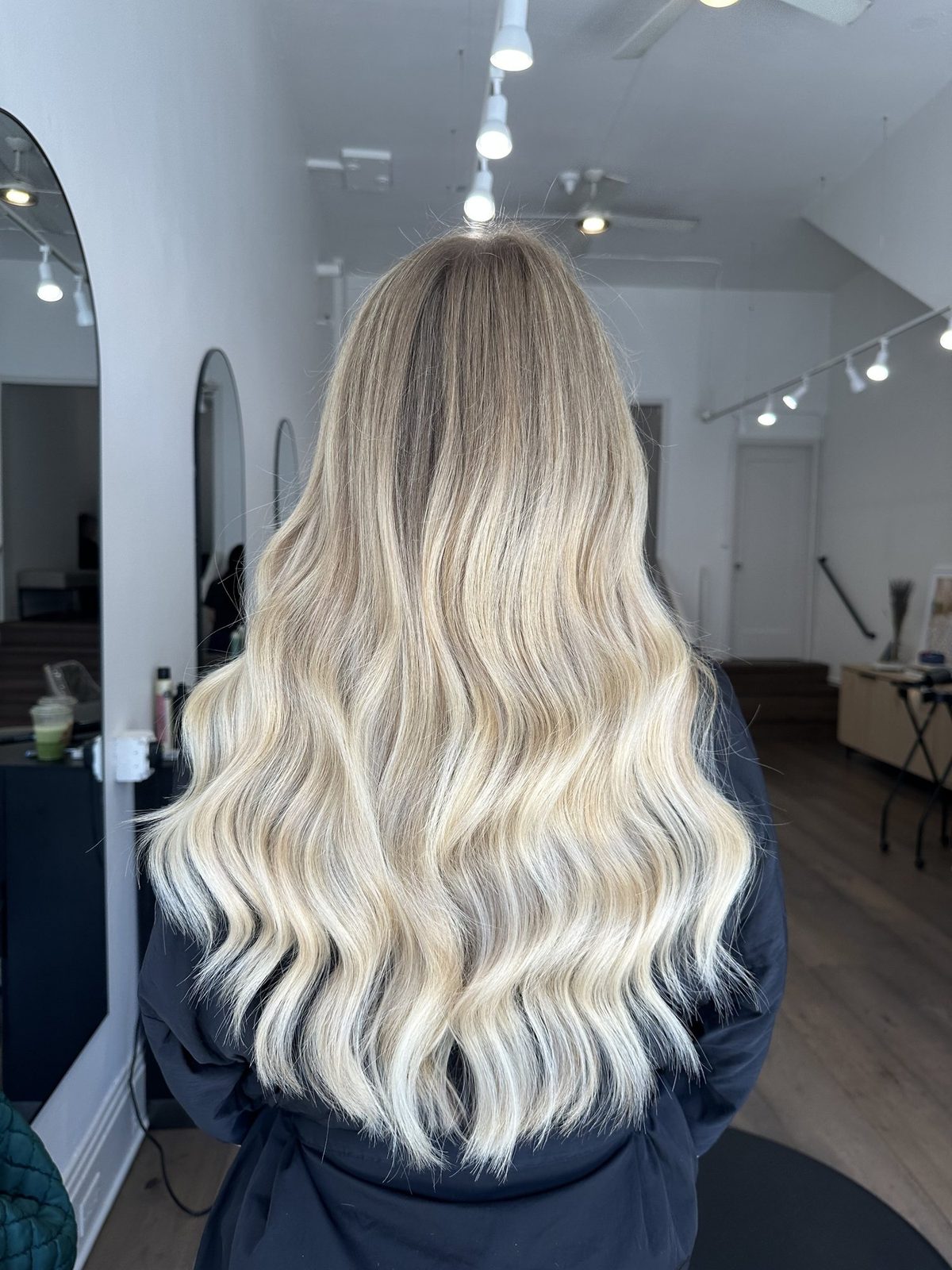 Long, seamless platinum hair extensions at Era Salon