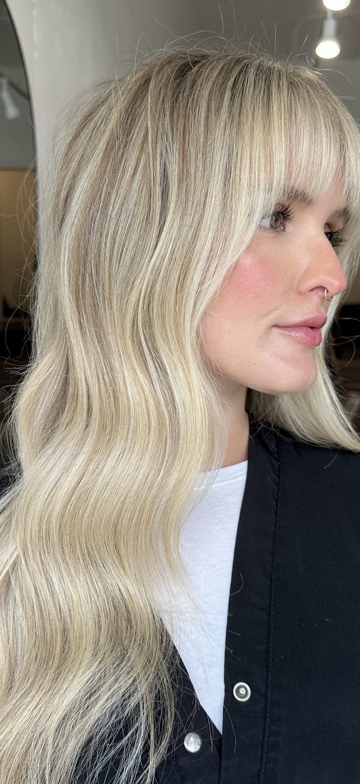 Face-framing blonde with soft curtain bangs